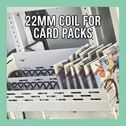 22mm vending machine coil holding trading card packs, shown installed in a card vending machine tray