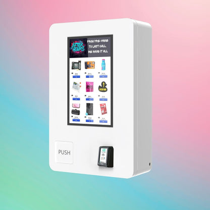 After Hours Mini Wall — modern white wall-mounted vape vending machine with digital screen and push button, front-left angle.