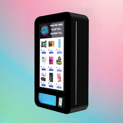 After Hours Slim Wall — modern black wall-mounted vape vending machine with digital screen and glowing blue dispense slot, angled left view.