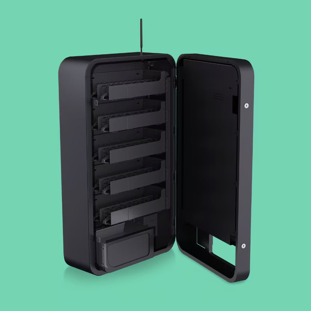 Interior view of the Pokemon Slim Wall TCG vending machine with open door showing 5 empty coil shelves and full aisle configuration ready for restocking booster packs