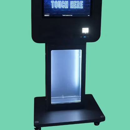 Slim wall pedestal base with vending machine display and illuminated product compartment in black metal finish