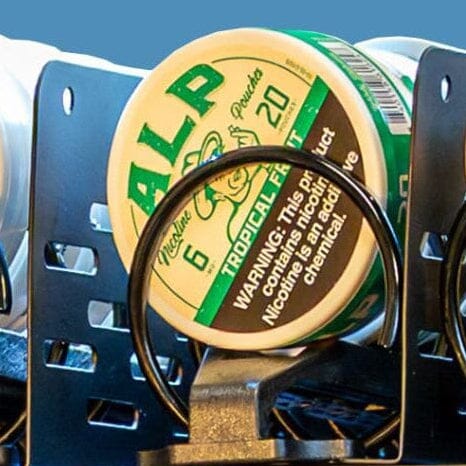 nicotine pouch tin adapter that lifts and presents tins inside coil-style vending machines